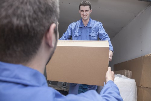 Removal team planning a move in New Barnet residential street