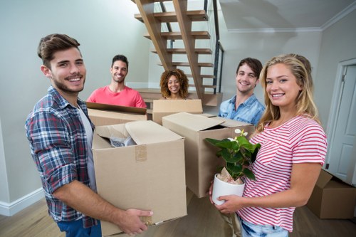 Removal van and moving crew in a New Barnet residential street