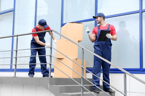 Removal team handling property access and loading safely