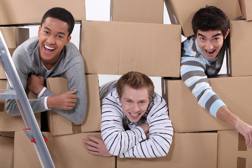 Furniture and boxes being moved by a local man with van service