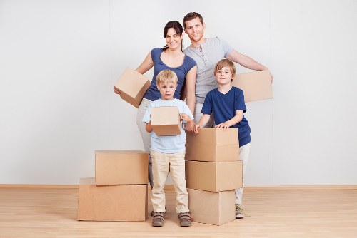 Professional movers handling desks and IT items during a New Barnet office move