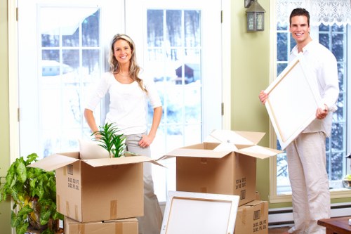 Furniture and boxes being loaded into a van for a New Barnet move