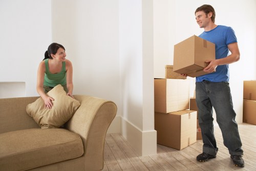 Packed moving boxes and wrapped furniture for a New Barnet relocation
